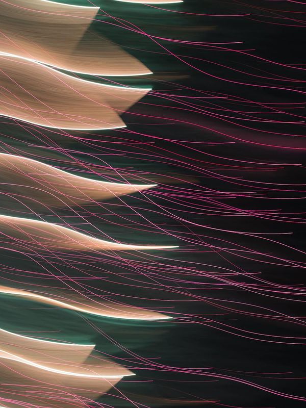 Abstract flowing energy lines on a dark background